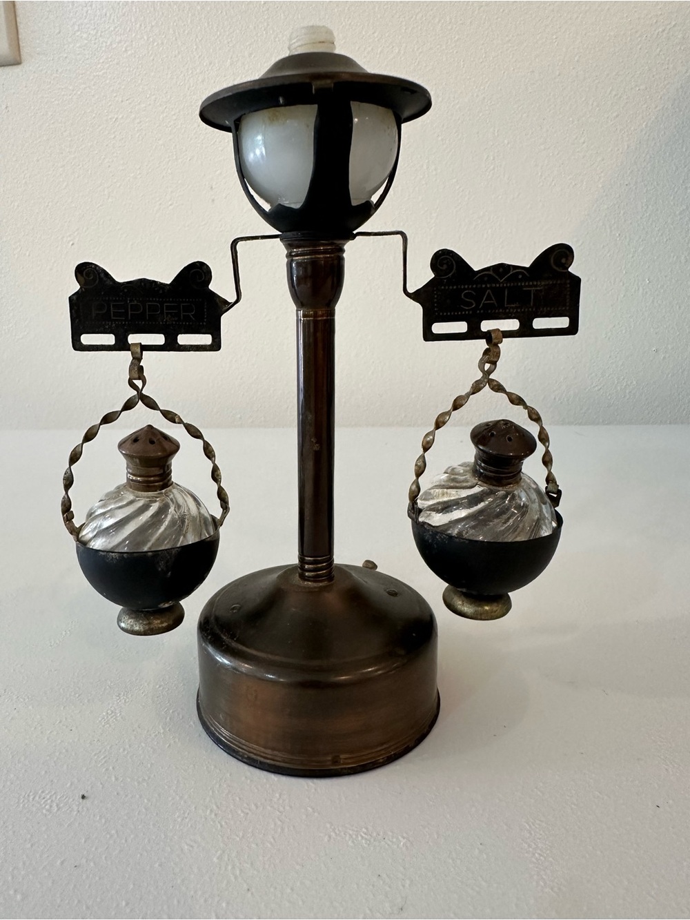 Vintage light, post salt and pepper shaker.